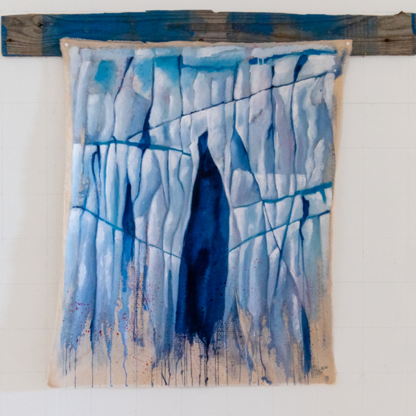 Painting of the surface of a glacier with an ice cave, the painting is splattered with red paint as a reminder of the near extinction of whales and walrus in the Arctic