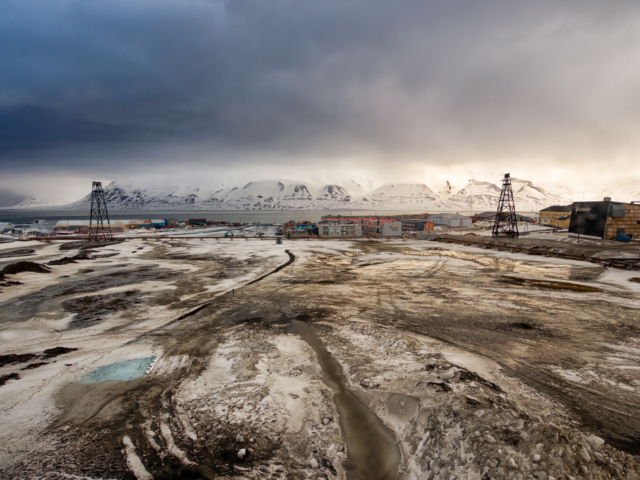 Flood Plain Ice melts in spring revealing the muddy flood plain of the Longyear River in Svalbard