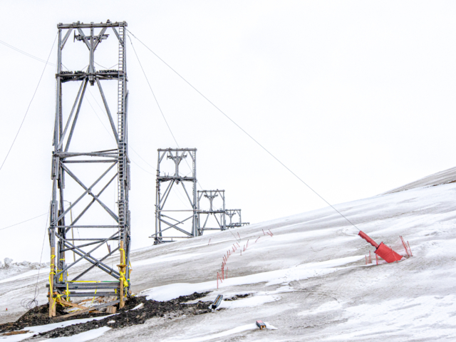 Cultural Heritage Gray cable towers cross the snowy winter landscape.