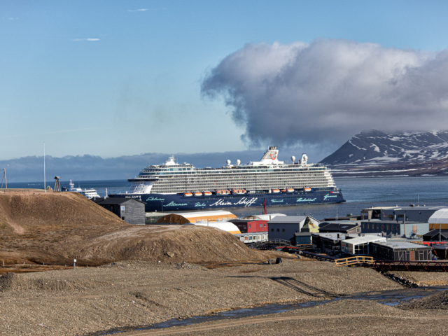 Mein Schiff 4 Docks at Longyearbyen Mein Schiff 4 comes in to Port in Longyearbyen on a clear summer day