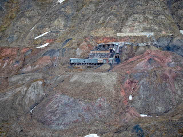 Mine 2 Abandoned mine 2b against orange brown and black hillside in Longyearbyen
