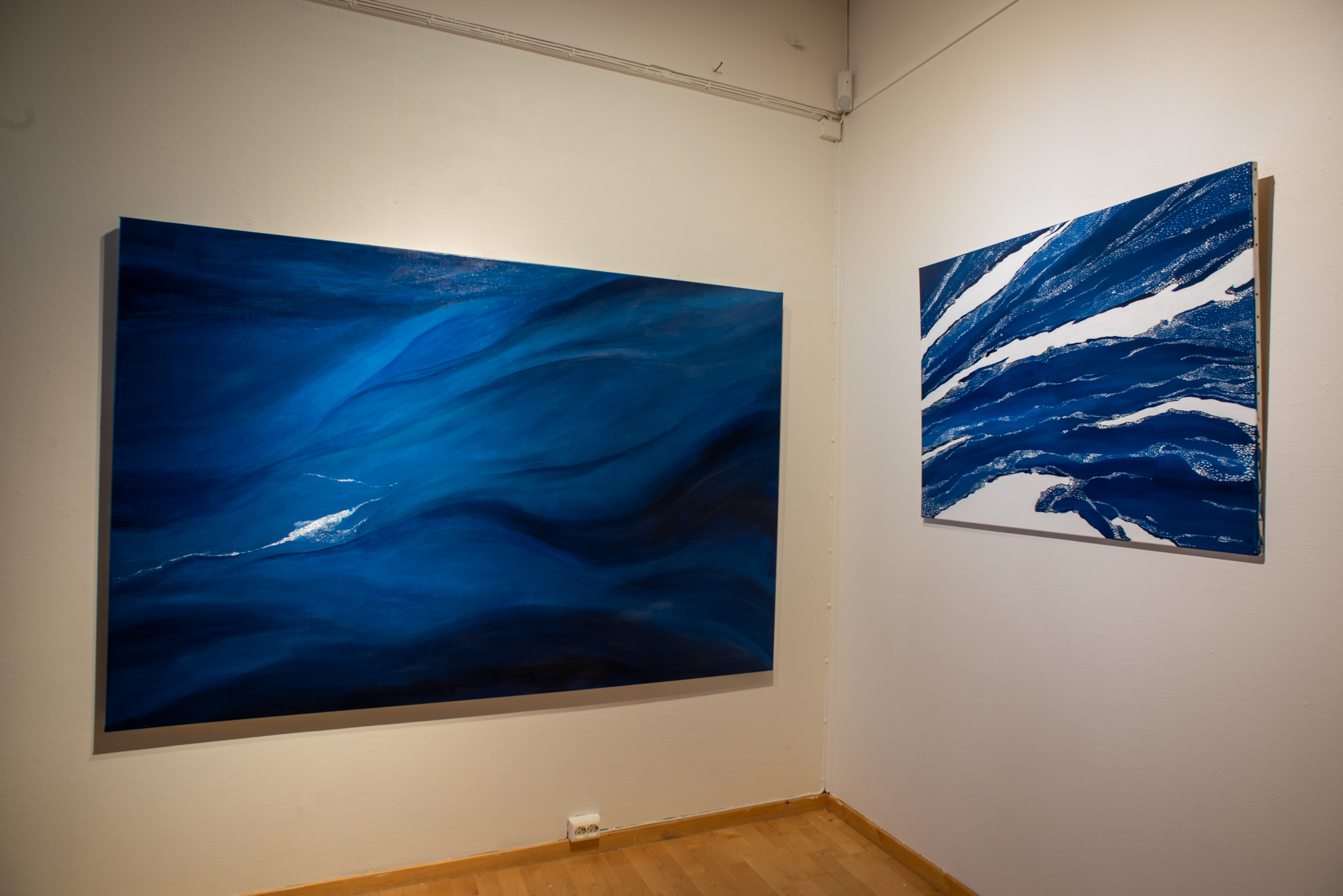 Two paintings of drift ice in blue color