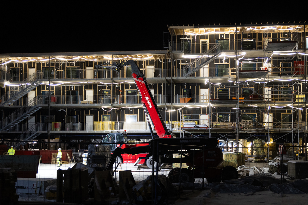 Family Housing Construction Photograph of building construction at night